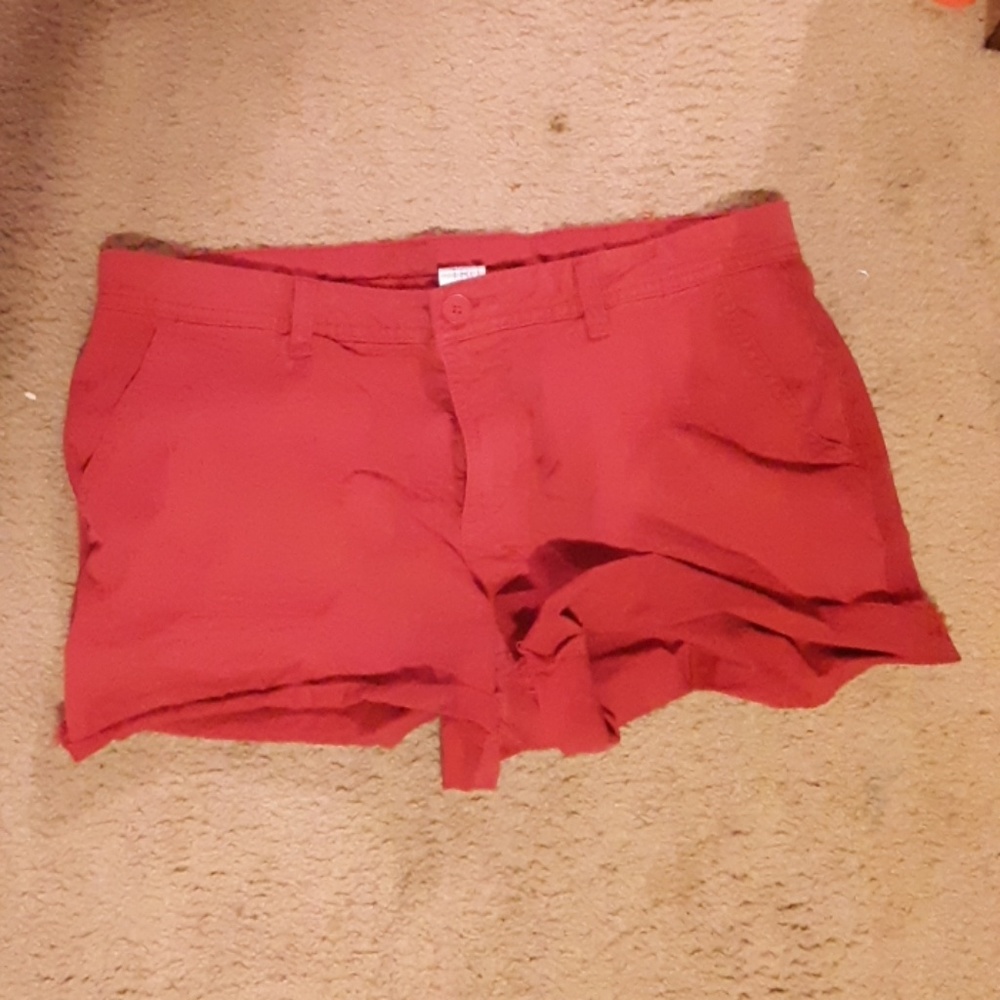Red and coral pairs of spring/summer shorts